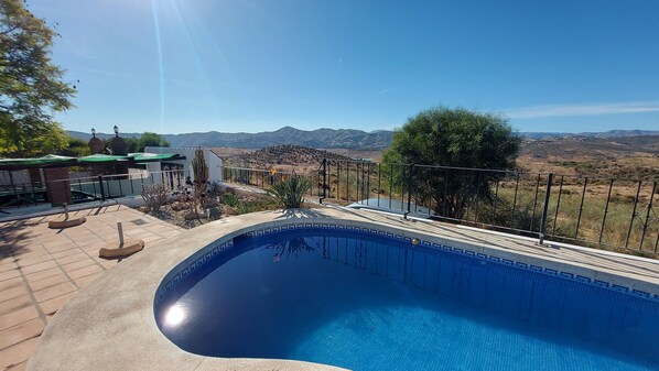 Taking pleasure in the scenery while immersed in the pool