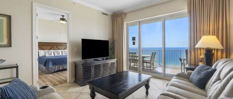 Ocean Front Living Area with Flat Screen TV and Private Balcony Access