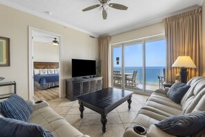 Ocean Front Living Area with Flat Screen TV and Private Balcony Access