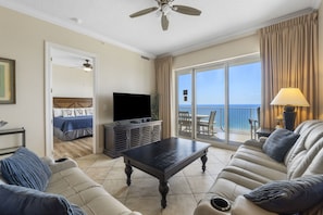 Ocean Front Living Area with Flat Screen TV and Private Balcony Access