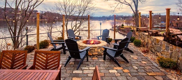 Relax by the firepit and enjoy the stunning Candlewood Lake views.