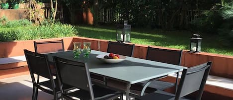 Terrace with a dining table suitable for 10 persons.