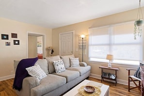 Bright Living Room with comfy seating to relax and watch TV, read a book or chat with friends.