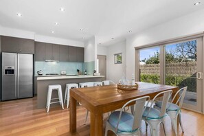 High ceilings and natural light over the dining table