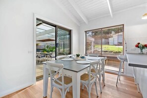 The light-filled dining and kitchen zone is ideal for family meals