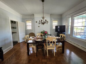 Large Diningroom q/ view of porch with pocket doors