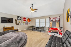 The ultimate game room! Ping pong, arcade basketball, TV and 2 giant bean bags!