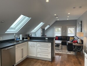 Kitchen has plenty of counter space, dishwasher, coffee maker & electric kettle.