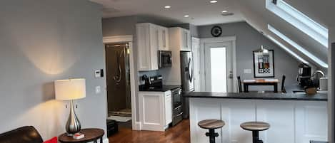 Four skylights brighten the fully-equipped kitchen & living room.