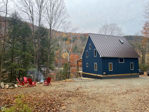 View of the cabin upon arrival, looking East towards the creek below. 