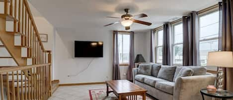 Living Room With Sleeping Sofa And Smart TV