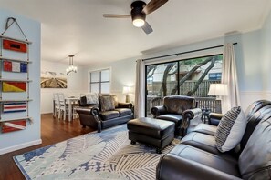 Living Room with Plenty of Seating and Access to Back Patio