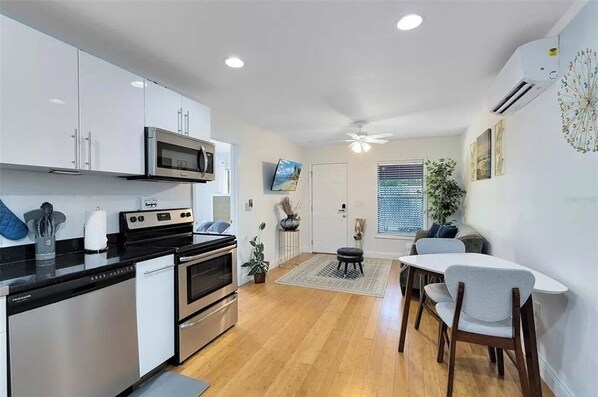 Living, dining room, kitchen space.