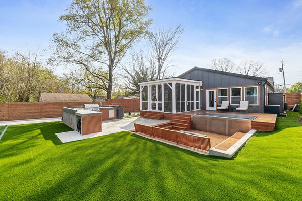 outdoor kitchen, 10 person hot tub, fire pit and more. 