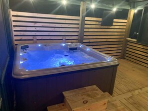 Soak away the day in the private hot tub