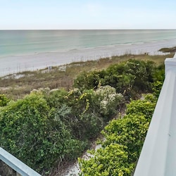 Overlooking the private boardwalk and un-touched dunes of Inlet Beach
