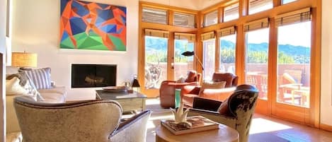 Luxury leather seating, swivel chairs, wall of windows, 55”TV, sweeping views