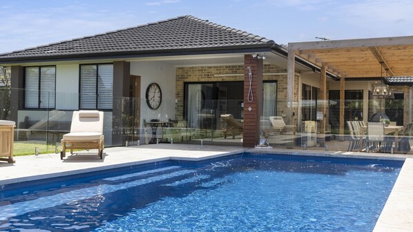 Resort style in ground solar-heated swimming pool 