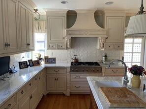 Kitchen with marble counters, best appliances including ovens, warming drawer
