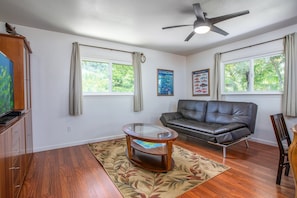 Sit down and relax in this simple and clean living area with flat screen tv. Perfect for a quiet night in.