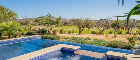 Sunny views of jacuzzi and infinity pool