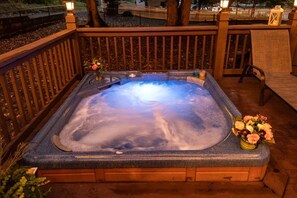 Relax in the hot tub surrounded by dancing flame solar candle lights.