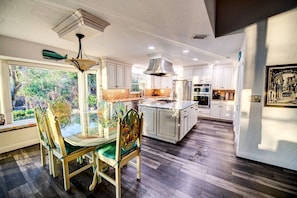 Open concept kitchen w/high-end stainless-steel appliances