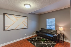 This long, black sofa area is another roomy location in the house