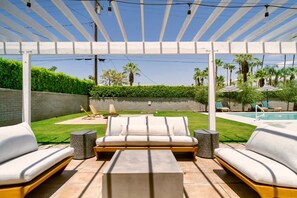 Outdoor living room just off the double sliding doors in the primary bedroom.