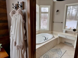 Primary bathroom on the main floor with jacuzzi tub.