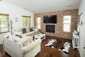 Cozy Living Room with Queen Sofa Sleeper, Fireplace, 55" Smart TV with DISH and Streaming Channels