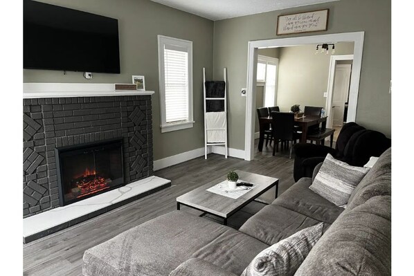 Living room with electric fireplace.