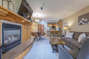 Cozy Living area includes gas fireplace, dining and open Kitchen