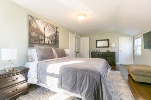 Bedroom 1 (largest).Queen Bed, Smart TV, Dresser Desk with Ergonomic Chair.