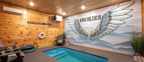 Private heated indoor pool with hand painted wall mural