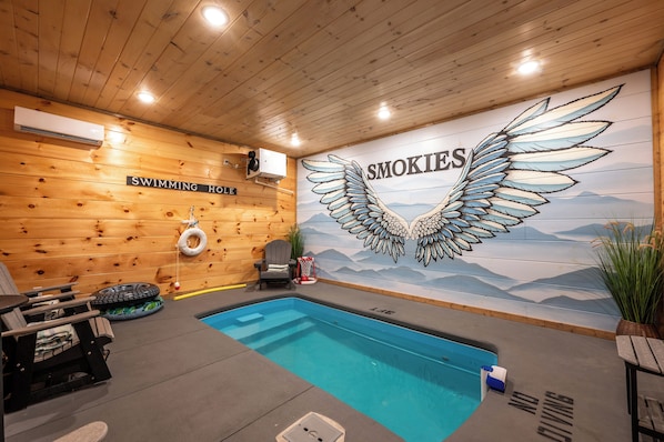 Private heated indoor pool with hand painted wall mural