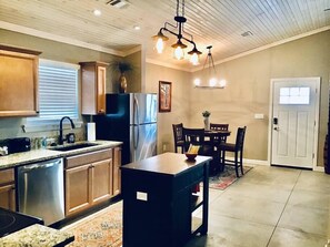 Open kitchen, dining, living area