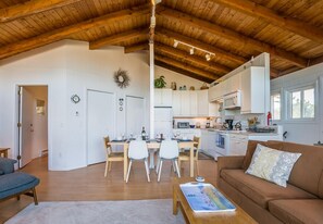 Open concept living room, dining room looking toward kitchen.