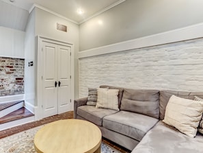 Stairs lead down to the living room from the main entry level.