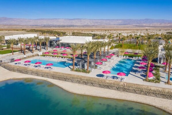 Community pool, workout facilities, and bar.