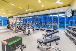 Community pool, workout facilities, and bar.