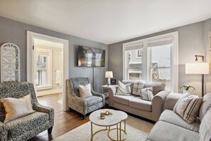 55" TV and additional room seating with access into first floor bath