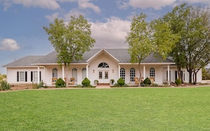 This beautiful large southern home sits on 1.25 acres. Perfect for large groups.