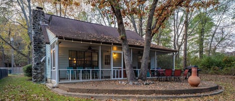 Back Exterior of Shore Acres Escape | Screened in Porch | Chiminea | Outdoor Dining | Charcoal Grill