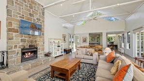 Lounge room with fireplace and flat screen TV