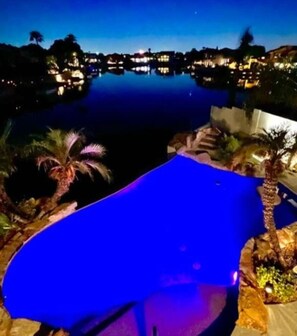 Water front with boat, heated infinity pool, private dock
