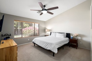 Bedroom featuring a cozy King sized bed