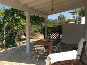 Patio with masonry barbecue and access to outdoor shower
