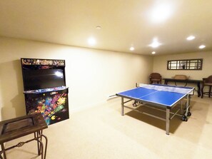 Game room with Arcade and ping pong.