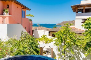 Lovely view, ocean and neighboring homes from the Living room and private pool.